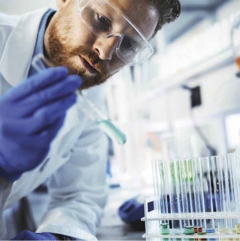 Man in lab coat in science lab